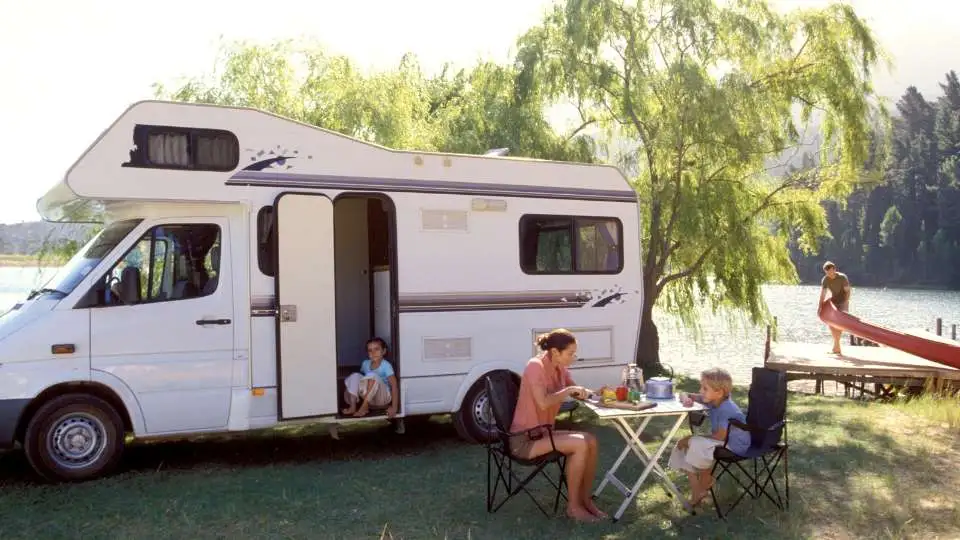 family-in-rv-near-lake